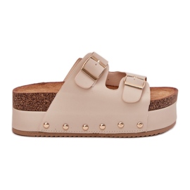 Infradito da donna con fibbie su una piattaforma enorme beige