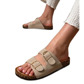 Le alette beige con morsetti su una suola di sughero