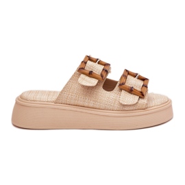 Infradito da donna sulla piattaforma con fibbie beige
