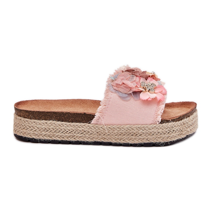Le pantofole da donna sulla piattaforma con fiori rosa