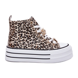 Sneaker alte femminili su una piattaforma enorme con leopardo leopardo d'oro