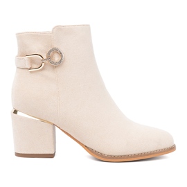 Shelvt Stivali beige leggeri sul palo con un morsetto decorativo