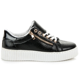 Sneakers stringate sulla piattaforma nero