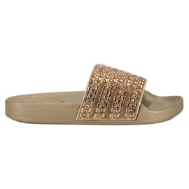 Eleganti pantofole dorate d'oro