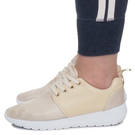 Sneakers sportive dorate d'oro