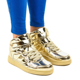 Sneakers laccate dorate XW7082 d'oro
