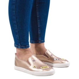 Sneakers dorate con stampe G82-5 d'oro