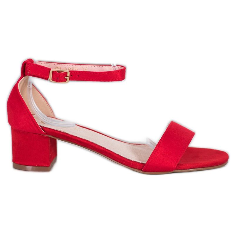 Small Swan Sandali rossi su un bar rosso