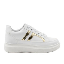 Le prime sneakers bianche bianco d'oro