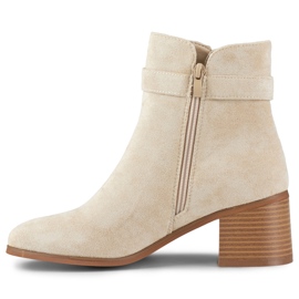 Stivaletti beige con tacco basso e fibbia 1