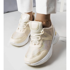 Sneakers beige con inserti metallici di Ruais 1