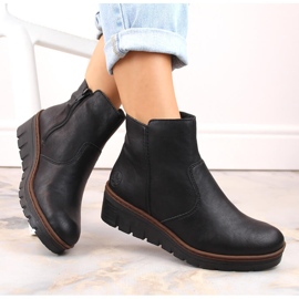 Comodi stivali con zeppa da donna neri isolanti Rieker X9165-00 nero 1