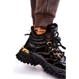 Stivali da trekking per scarpe sportive isolate da donna con una catena dorata nera nero 7