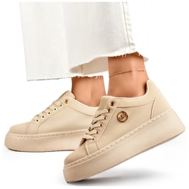 Sneakers beige da donna con suola spessa 1