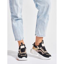 Sneakers nere e dorate con suola spessa nero 1