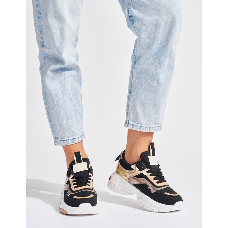 Sneakers nere e dorate con suola spessa nero 1