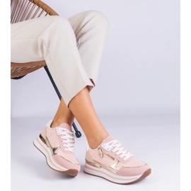 Sneaker sport rosa sulla piattaforma con un inserimento dorato 1