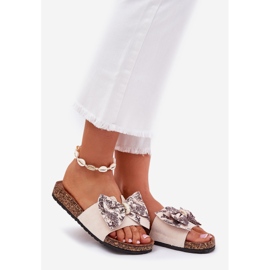 Pantofole da donna con un arco su una piattaforma di sughero beige 1