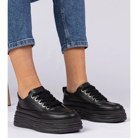 Sneaker da donna nera su una suola alta nero 1