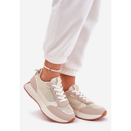 Scarpe sportive femminili con una mesh sulla piattaforma beige 1