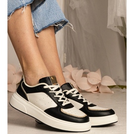 Sneaker da donna nera con un accessorio glitter nero 2