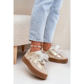 Sneaker da donna sulla piattaforma con decorazioni beige-oro 2