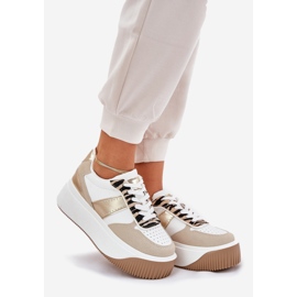 Sneaker da donna su una piattaforma enorme, modello di beige-o-oro 1