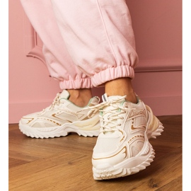 Sneaker sportive beige su una suola spessa 1
