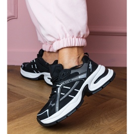 Sneaker sportive nere su una suola enorme nero 1