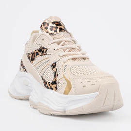 Sneaker beige con un motivo animale 1