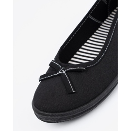 Balerina di materiale nero con un arco 1