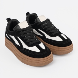 Sneaker da donna nera con inserti bianchi. nero 2
