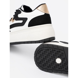 Shelvt Sneaker in bianco e nero con dettagli dorati 1