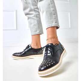 Scarpe da donna nera con borchie di greschi nero 2