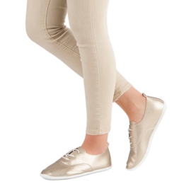 Sneakers annodate dorate d'oro 2