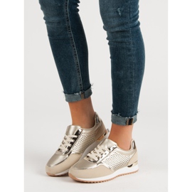 Scarpe sportive dorate d'oro 1