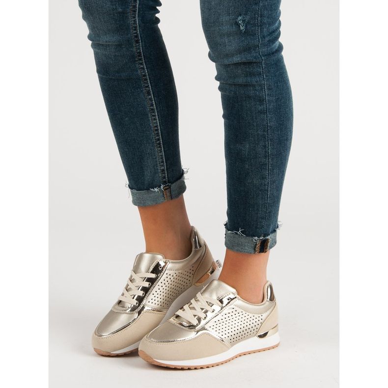 Scarpe sportive dorate d'oro 1