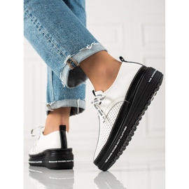 Scarpe brogue in pelle sulla piattaforma bianco nero 1